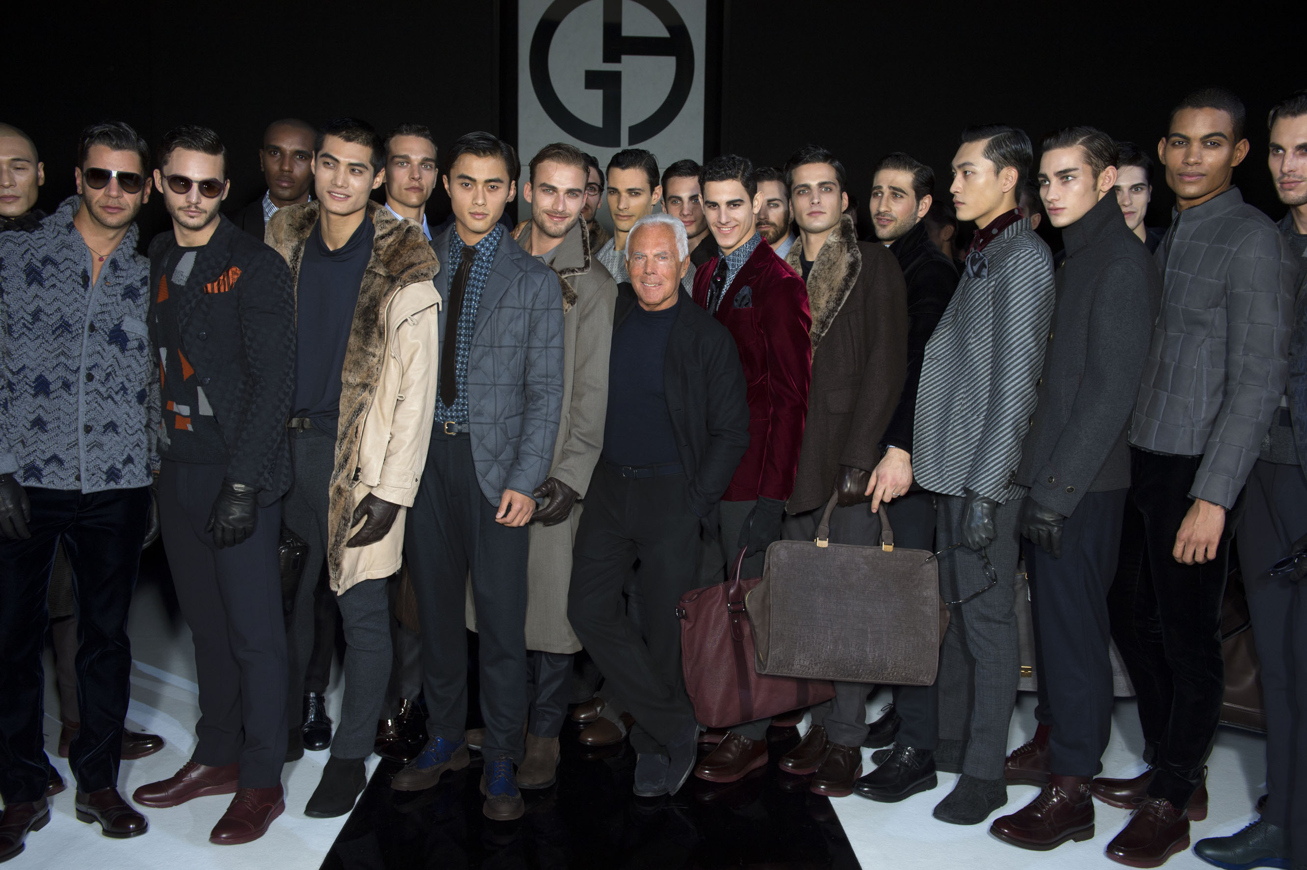 Giorgio Armani with models